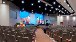 Panorama of Church Interior with Lit Stage.